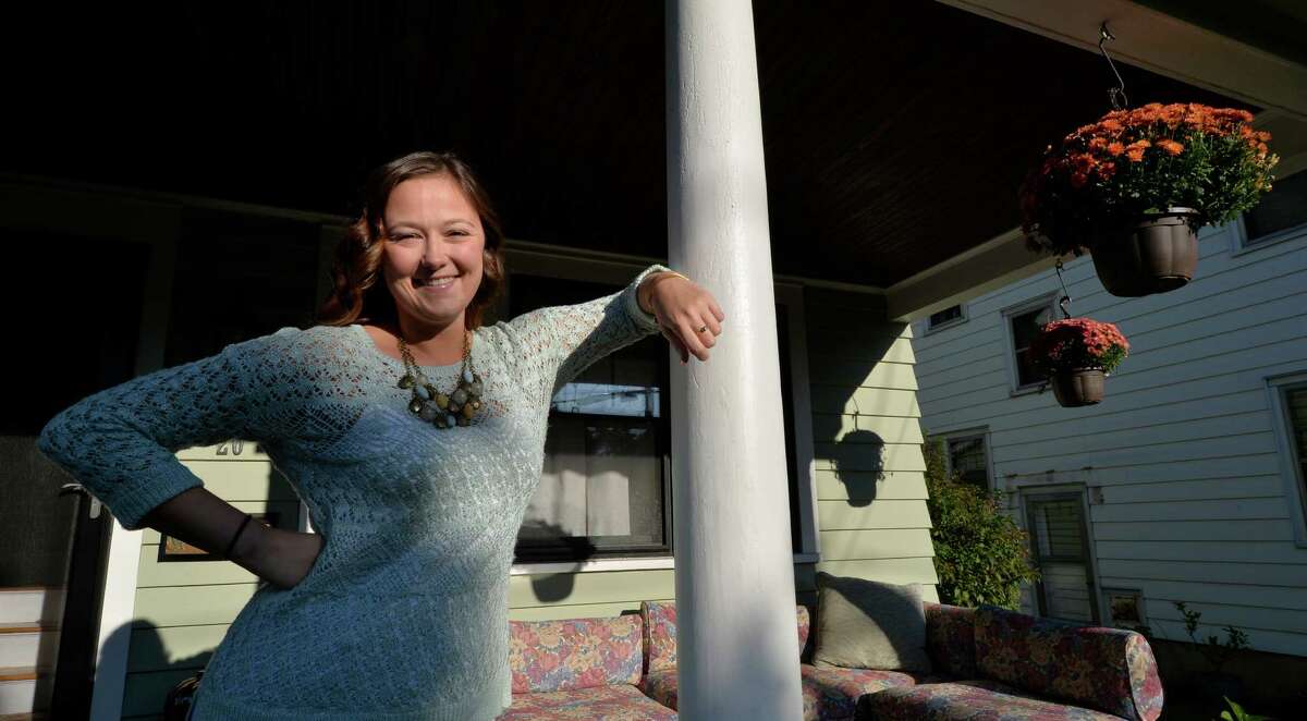 Alison Szczawinski stands on the front porch of her home on Rose Court Wednesday morning Sept. 24, 2014 in Albany, N.Y. (Skip Dickstein/Times Union)