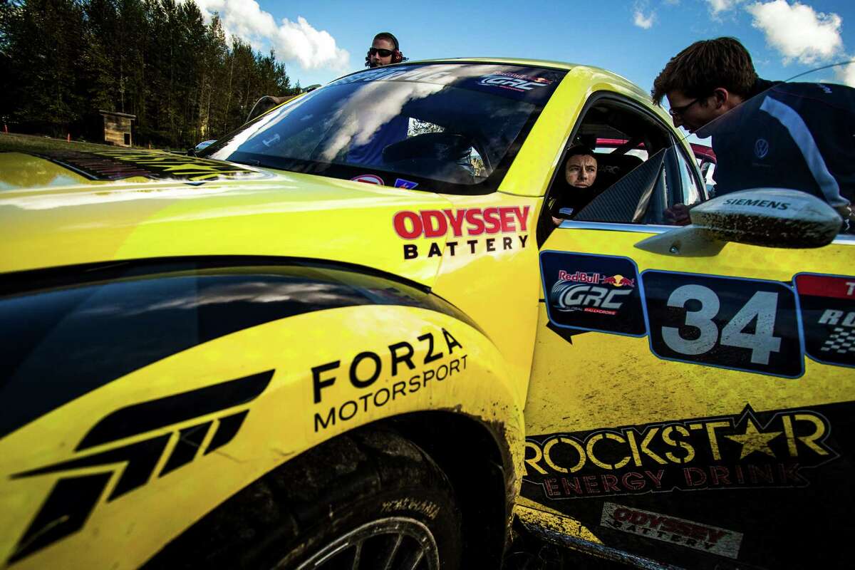 Drivers await their chance to take to the muddy twists of the course during a preview of the Red Bull Global Rallycross Championship Thursday, September 25, 2014, at DirtFish Rally School in Snoqualmie. The races on September 27th-28th will attract some of the top drivers in the sport to the competition. Rallycross uses small, production-based cars on courses that feature dirt, asphalt and table-top jumps.