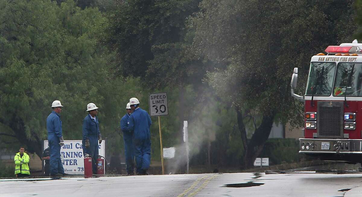 CPS workers inspect a natural gas leak that spews from a broken line at Donaldson and St. Cloud on the northwest side. Residents in the area were evacuated. Saturday, Sept. 27, 2014.