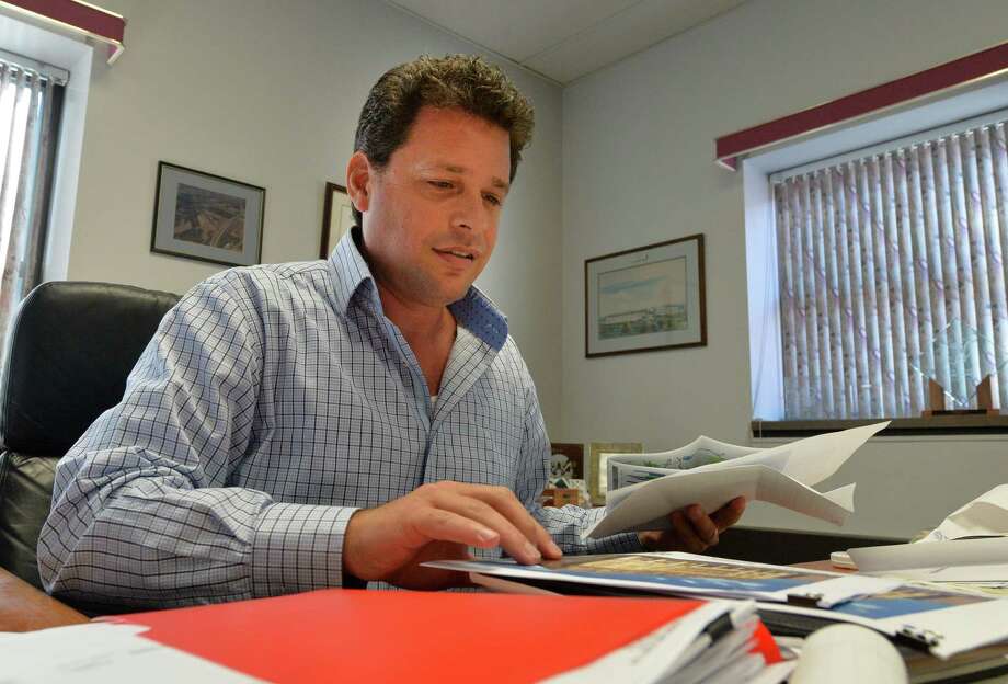 IDA executive director Robert Pasinella works in his office in the Rensselaer County Office building in Tuesday morning Sept. 9, 2014 in Troy, N.Y. The IDA said most of its projects create jobs and bring economic stability to the community.    (Skip Dickstein/Times Union) Photo: SKIP DICKSTEIN / 00028520A