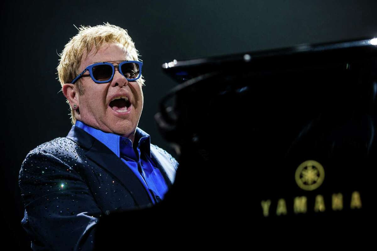 Legendary singer songwriter Elton John performs for thousands while on a stop of his current globe-trotting tour Saturday, Sept. 27, 2014, at KeyArena in Seattle, Washington.
