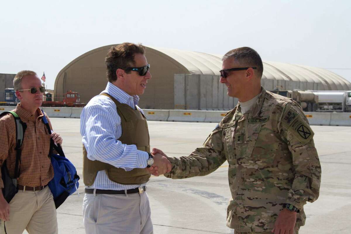 New York Gov. Andrew Cuomo is greeted by Regional Command-East Commander Maj. Gen. Stephen Townsend, right, at at Bagram Airfield, Afghanistan, Sunday, Sept. 28, 2014. Four U.S. governors made a surprise visit to Afghanistan on Saturday as part of a delegation to receive counterterrorism briefings and greet troops stationed there. Cuomo, along with Gov. Brian Sandoval of Nevada, Gov. Bill Haslam of Tennessee and Gov. Jay Nixon of Missouri, traveled with officials from the U.S. Department of Defense, which sponsored the trip, Cuomo's office said. (AP Photo/U.S. Army, Master Sgt. Kap Kim) ORG XMIT: NY120