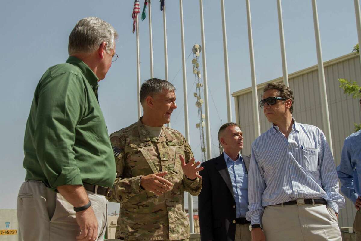 New York Gov. Andrew Cuomo, right, meets with Regional Command-East Commander Maj. Gen. Stephen Townsend, second from left, during a tour of Bagram Airfield, Afghanistan, in undated handout photo. Cuomo arrived in Afghanistan on Saturday, Sept. 27, 2014, as part of a delegation of governors visiting troops and receiving briefings on counterterrorism and security issues, his office said. (U.S. Army photo by Master Sgt. Kap Kim, Combined Joint Task Force-10 Public Affairs via The New York Times) -- EDITORIAL USE ONLY ORG XMIT: XNYT65