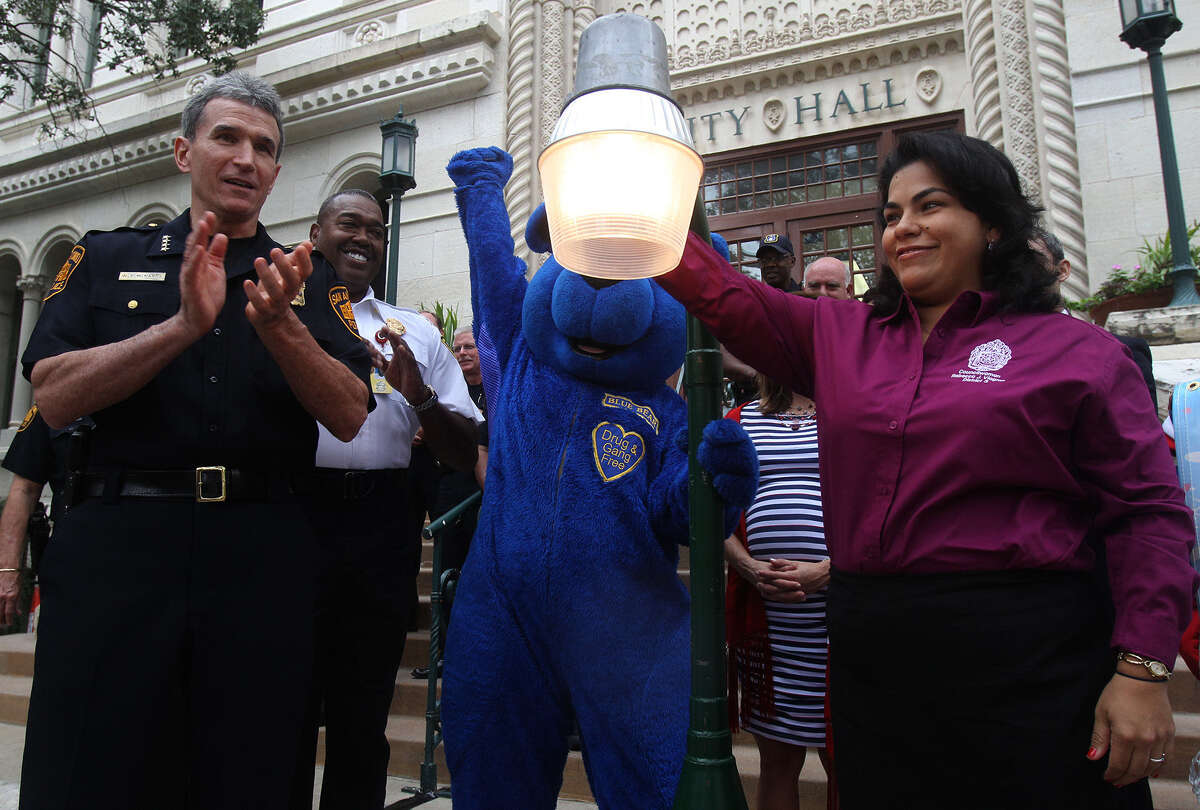 San Antonio Distict 3 City Council woman Rebecca Viagran, right, turns on a symbolic street light Oct. 1, 2013, in front of City Hall along with San Antonio Police Chief William McManus, left, San Antonio Fire Chief Charles Hood and the mascot Blue Bear, center, in recognition of last year's National Night Out.