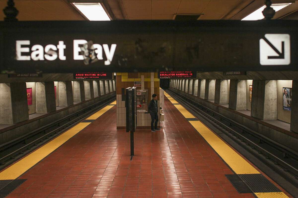 A lone passenger waits for one of the last BART trains back to the East Bay at the 24th Street BART station in San Francisco on September 29th 2014.