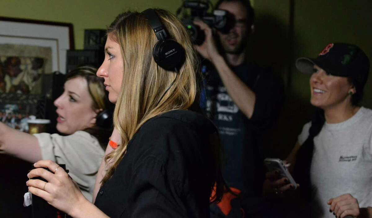 Director Anna Martemucci (with headphones) on the set of her film, “Hollidays-burg,” in Carnegie, Pa.