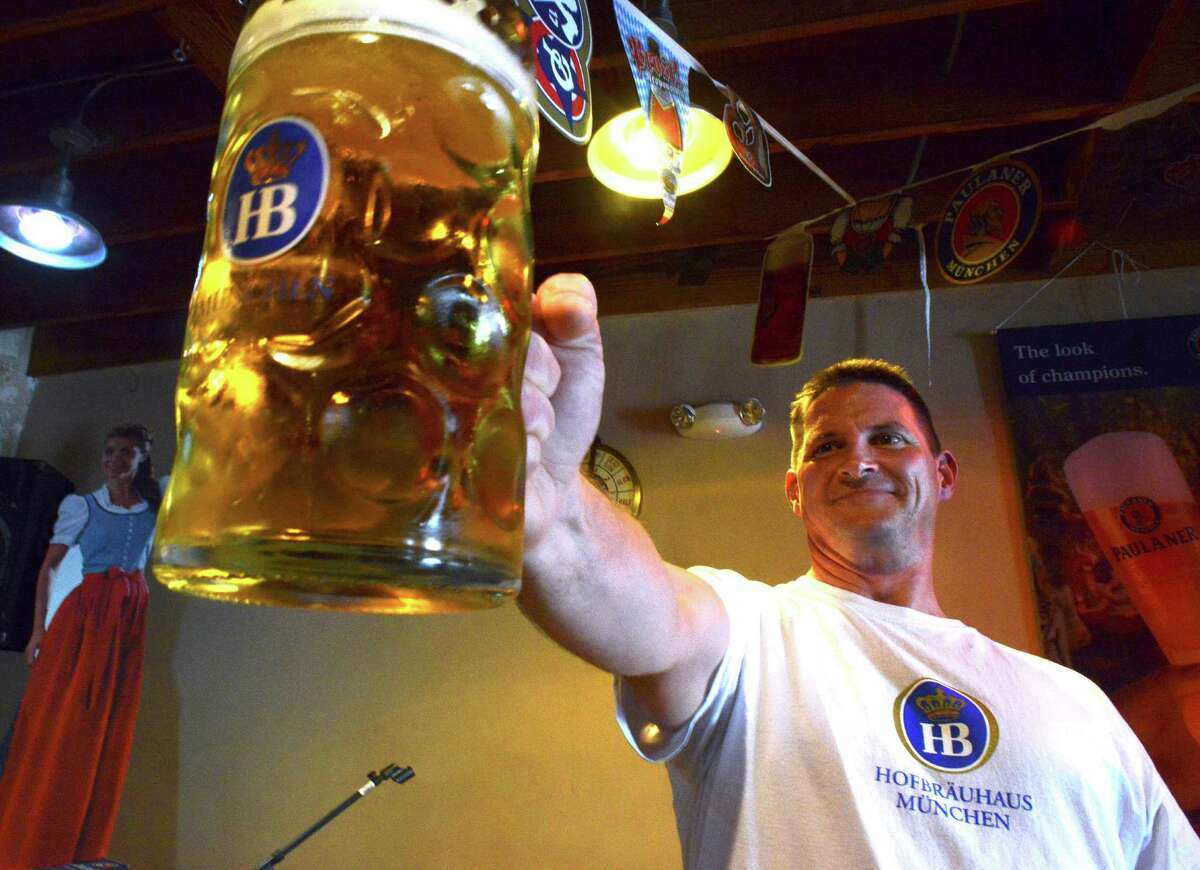 Jason Hurta of New Braunfels is the national champion of Masskrugstemmen, a German sport in which contestants hold with extended arm a 1-liter stein filled with beer for as long as possible. Sept. 26, 2014.