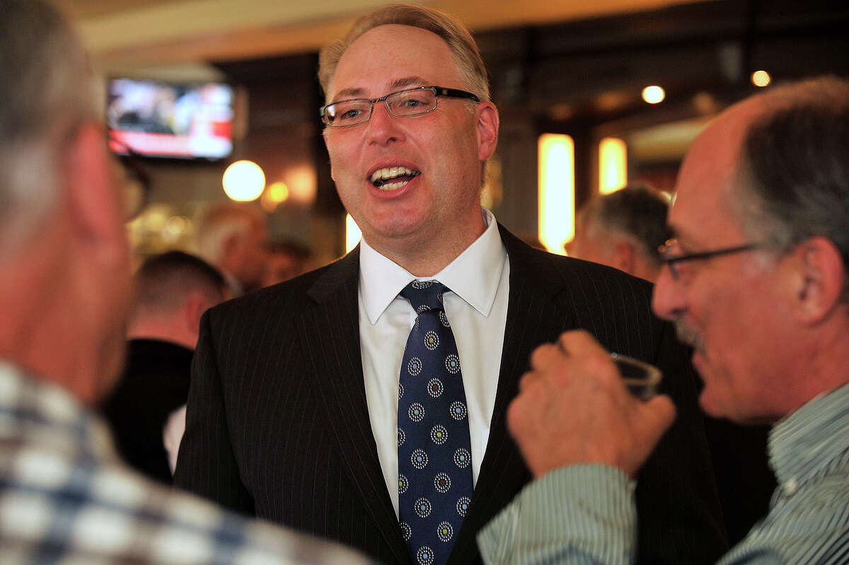 James Gueltzow, executive vice president for Washington Trust Mortgage Company, chats with others during an announcement party for the opening of Washington Trust Mortgage Company at Ten Twenty Post Oyster Bar in Darien, Conn., on Tuesday, Sept. 30, 2014.