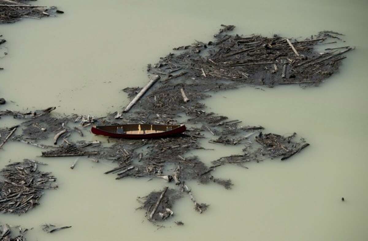 This Tuesday, Aug. 5, 2014 aerial photo shows the damage caused by a tailings pond breach at the Mount Polley Mine in British Columbia. (AP Photo/The Canadian Press, Jonathan Hayward)