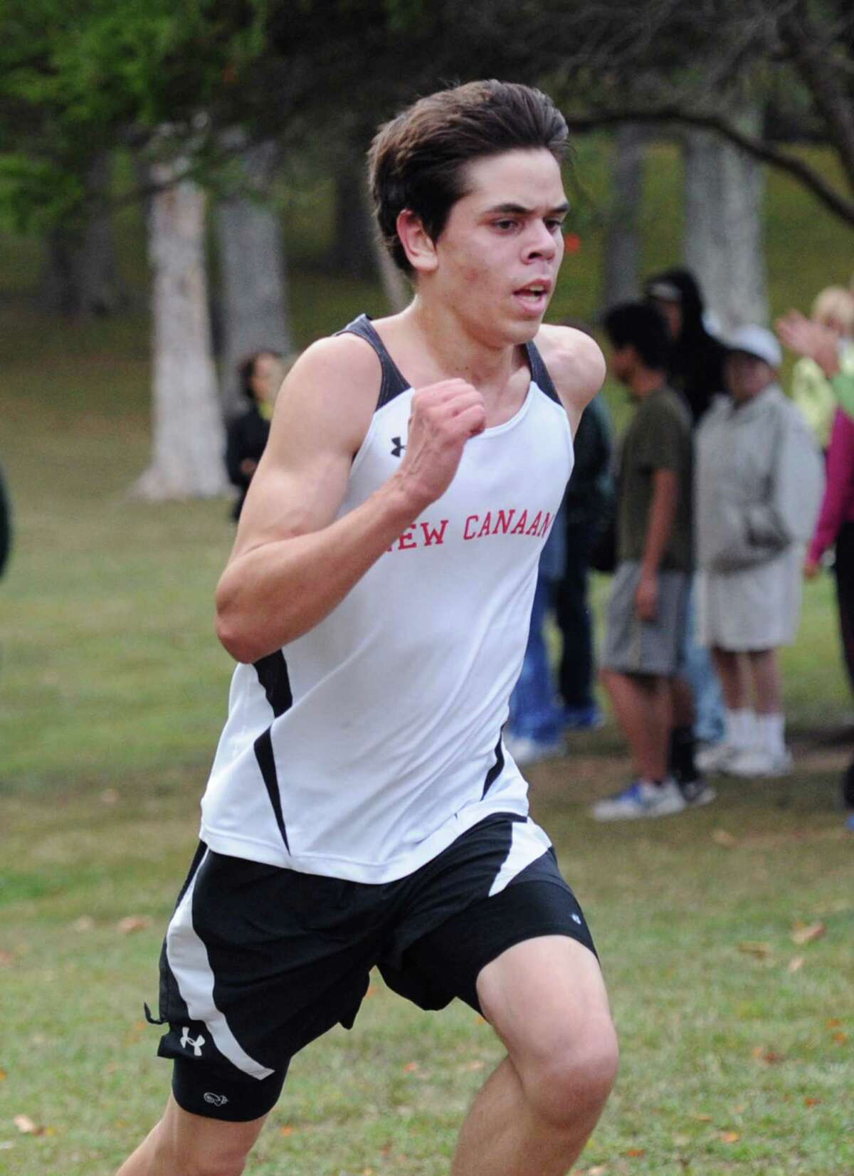 New Canaan's Alex Ellsworth runs during an FCIAC boys cross country meet at Greenwich Point on Tuesday, Sept. 30.