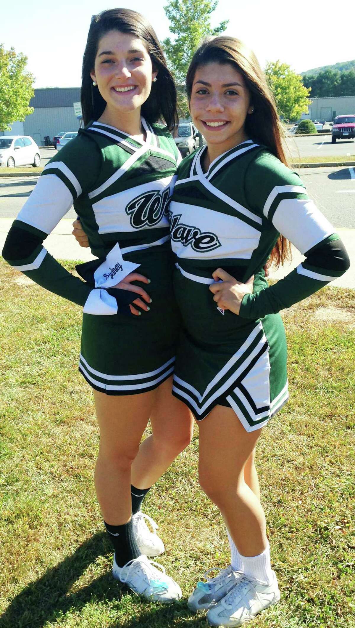 Sydney Fairchild, left, and Alyssa Santos of the New Milford High School cheerleading squad are fundraising for a planned trip to London, England. October 2014 Courtesy of Colleen Fairchild