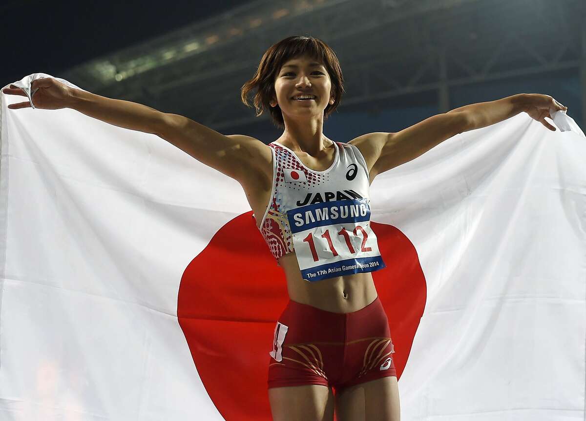 Wave that flag: Japan's Ayako Kimura is as proud as can be to have won...
