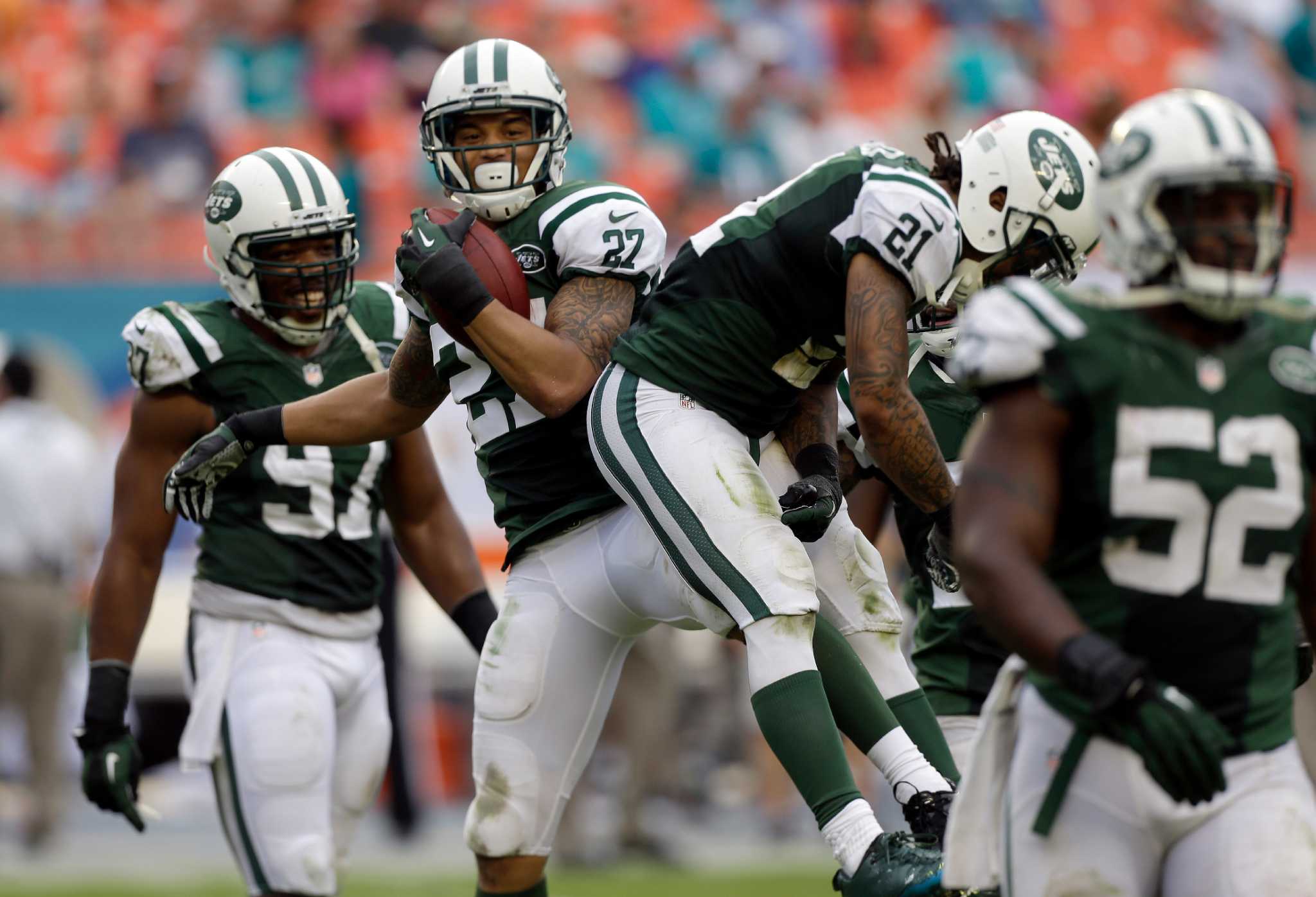 New York Jets' Dee Milliner leaves the field after an NFL football