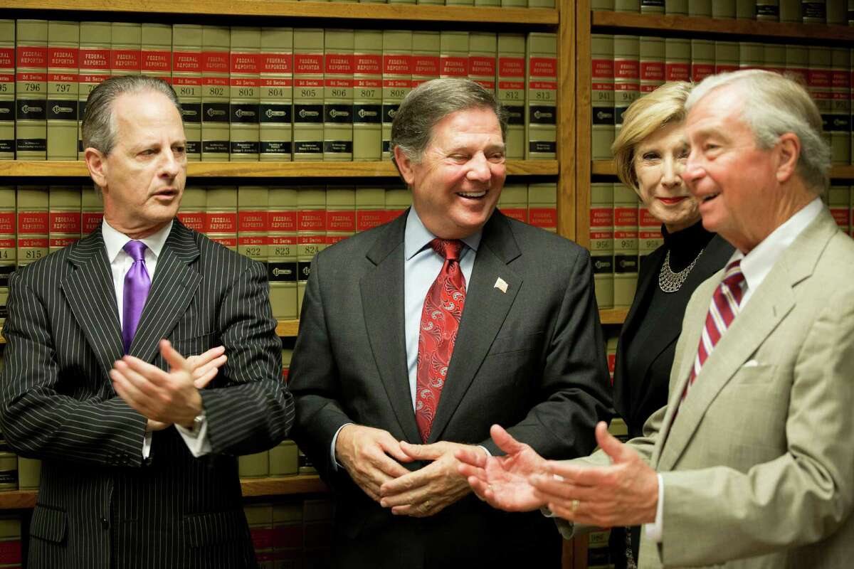 Former House Majority Leader Tom DeLay, second from left, with attorneys Brian Wice, left, Adele Hedges and Dick DeGuerin, is all smiles after the Court of Criminal Appeals refused to reinstate two money-laundering convictions.