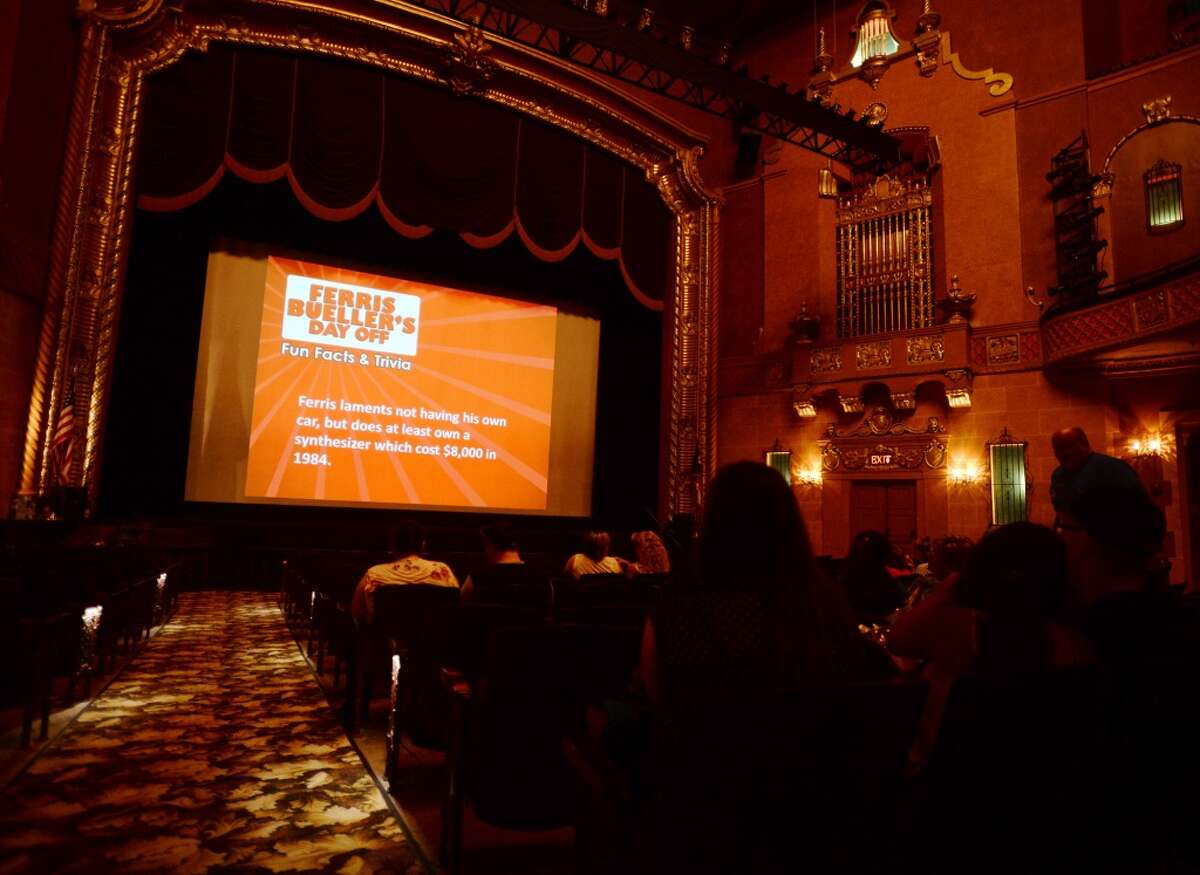 Movie trivia and other slides play on the big screen at the Jefferson Theater before Friday's showing of "Ferris Bueller's Day Off." The Jefferson Theater hosted a showing of "Ferris Bueller's Day Off" for the kick off of Beaumont's Classic Movie Night series on Friday. The movie was the first of a run of 12 feature films to be shown at the historic theater. Photo taken Friday 8/15/14 Jake Daniels/@JakeD_in_SETX