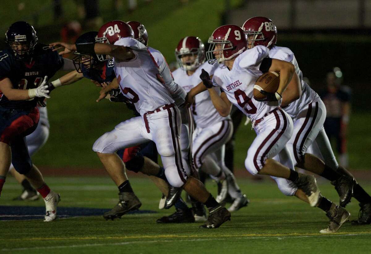 Bethel's Ross Moravsky (9) runs with the ball during a football game between Bethel and New Fairfield High Schools , on Thursday, October 2, 2014, in New Fairfield, Conn.