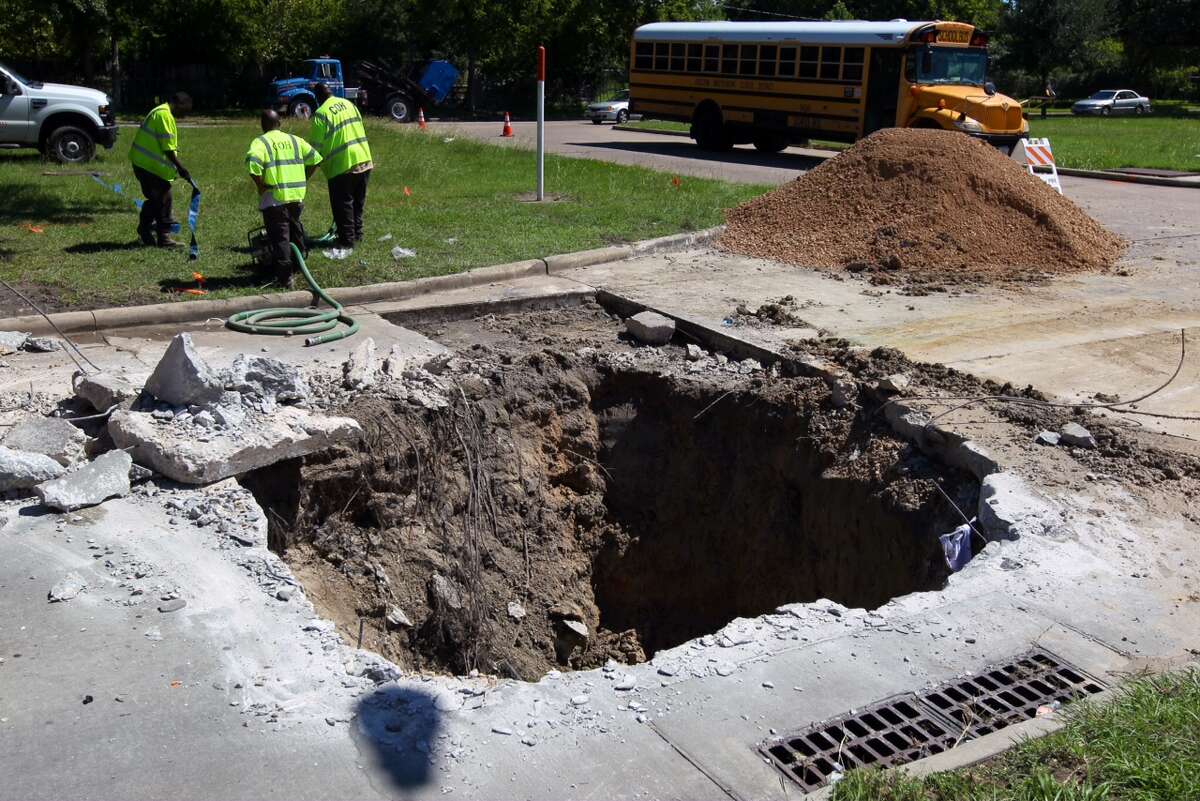 Heavy rains cause cavein on Houston road