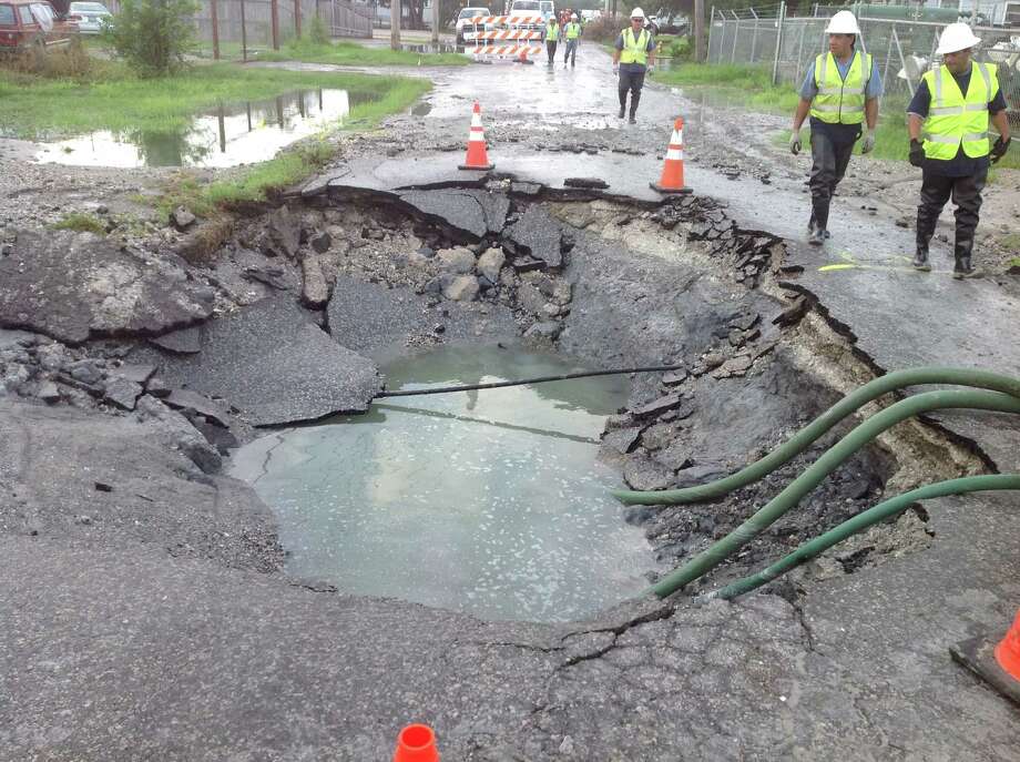 Rig Partially Swallowed By Sinkhole In Downtown Corpus Christi A Water Main Break Near Downtown Corpus Christi Caused Sinkhole To Form Partially Swallowing