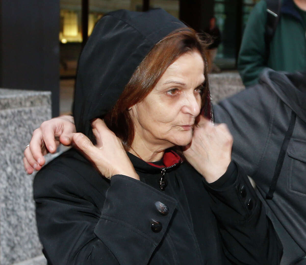 FILE - In this Oct. 22, 2013, file photo, Rasmieh Yousef Odeh stands outside the federal courthouse in Chicago. She is charged with immigration fraud, accused of lying to U.S. immigration officials when she failed to disclose her conviction for a terrorist bombing at a Jerusalem supermarket in 1969 that killed two people. On Thursday, Oct. 2, 2014, U.S. District Judge Gershwin Drain in Detroit rejected Odehâs lawyersâ request to throw out the charges on the basis that they were the result of a selective prosecution because of Odehâs activism in the Arab-American community. The judge scheduled her trial to begin Nov. 2, 2014 in Detroit. (AP Photo/Charles Rex Arbogast, File)