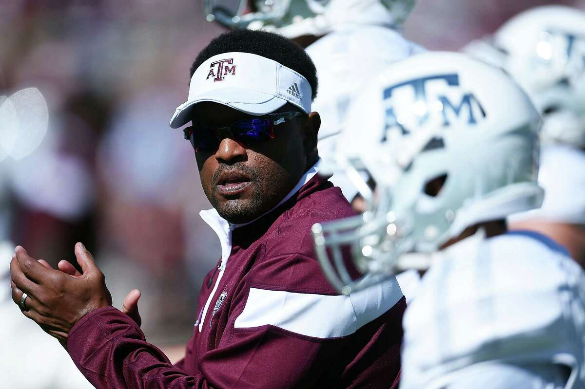 STARKVILLE, MS - OCTOBER 04: Head coach Kevin Sumlin of the Texas A&M Aggies leads his team onto the field prior to a game against the Mississippi State Bulldogs at Davis Wade Stadium on October 4, 2014 in Starkville, Mississippi.