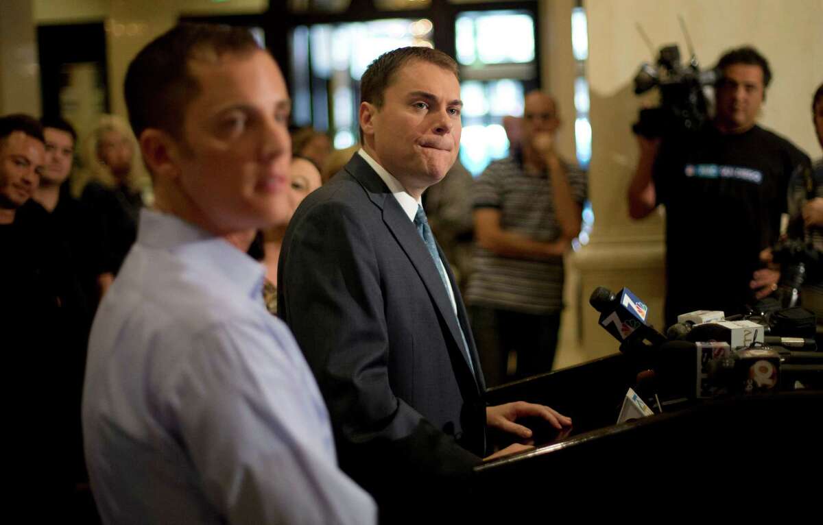 FILE - In this Wednesday, Nov. 7, 2012 file photo, San Diego city councilman Carl DeMaio, Republican candidate for mayor, center, gives a news conference alongside his partner Jonathan Hale, left, in San Diego. DeMaio conceded defeat to Democratic Congressman Bob Filner in the race for mayor of the country's eighth-largest city. (AP Photo/Gregory Bull)