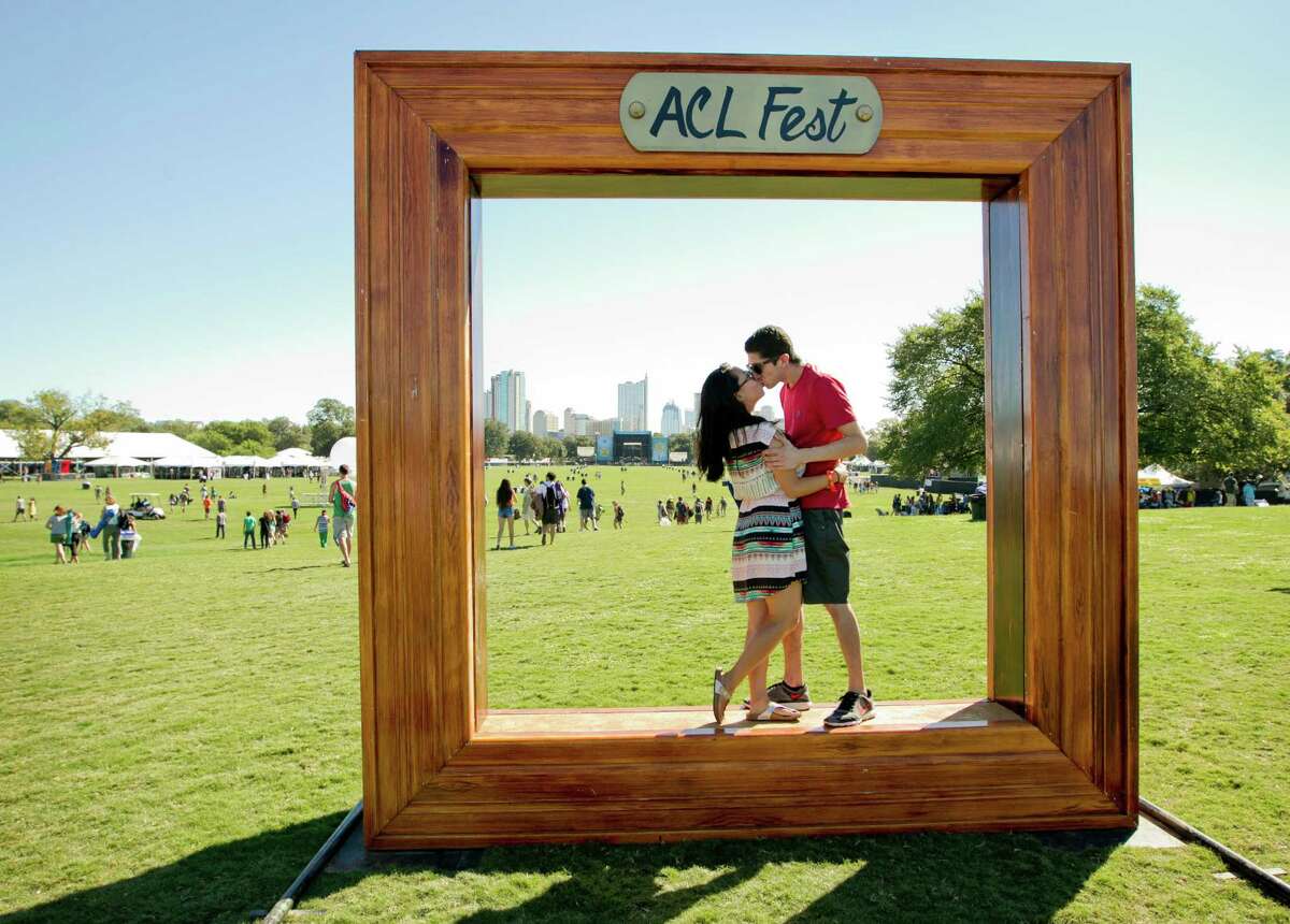 Christine Choi kisses her fiance Kyle Ruiz at the Austin City Limits Music Festival in Zilker Park, Friday, Oct. 3, 2014, in Austin, Texas.