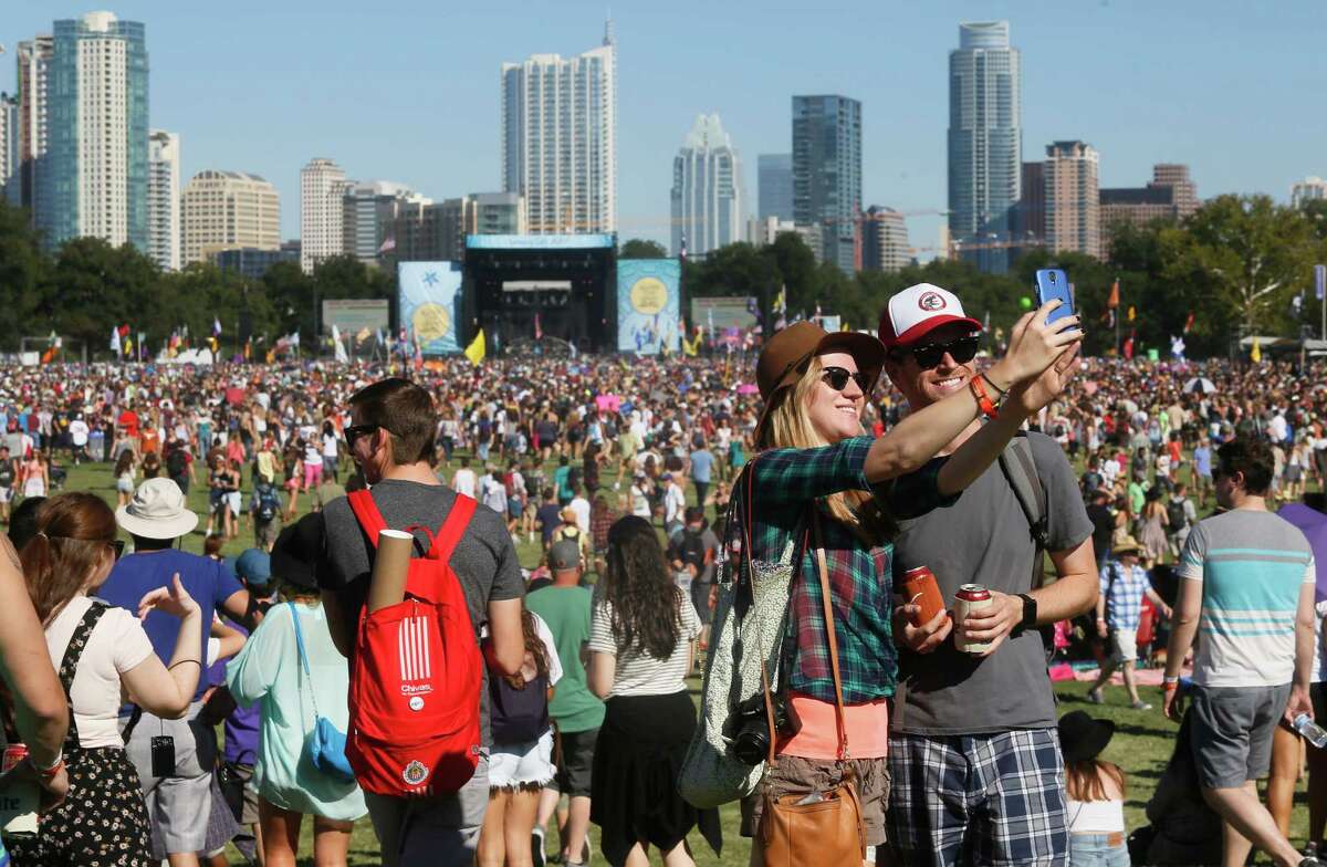 John and Sara Vershaw take a selfie photo at the Austin City Limits Music Festival on Saturday, Oct. 4, 2014, in Austin, Texas.