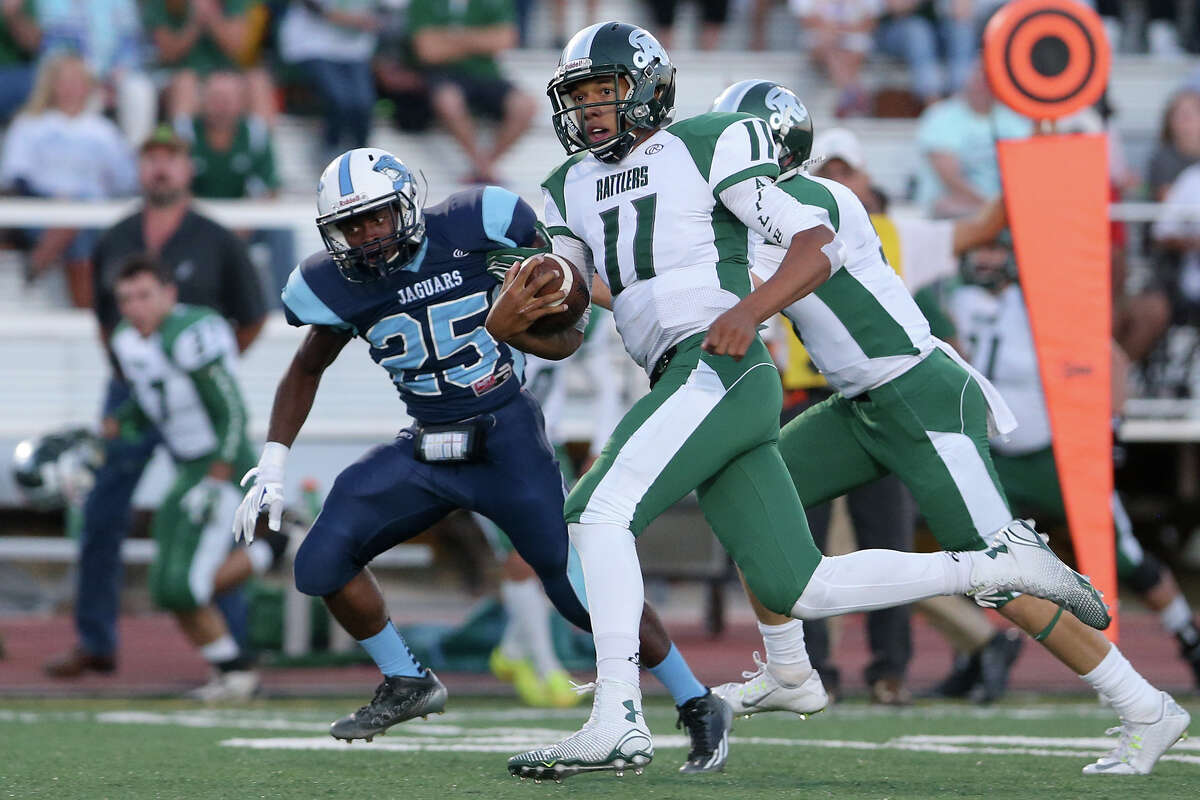 Reagan quarterback Kellen Mond finds running room during the first quarter of their game with Johnson at Comalander Stadium on Saturday, Oct. 4, 2014. MARVIN PFEIFFER/ mpfeiffer@express-news.net