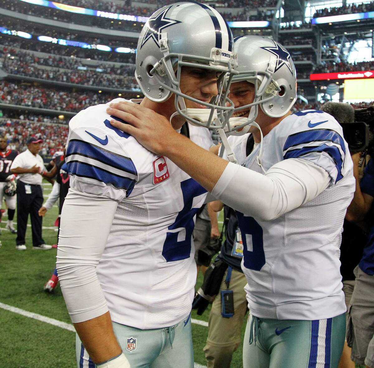 Dallas Cowboys kicker Dan Bailey (5) celebrates his field goal with Cowboys punter Chris Jones (6) during overtime during an NFL football game at AT&T Stadium, Sunday, Oct. 5, 2014, in Arlington.