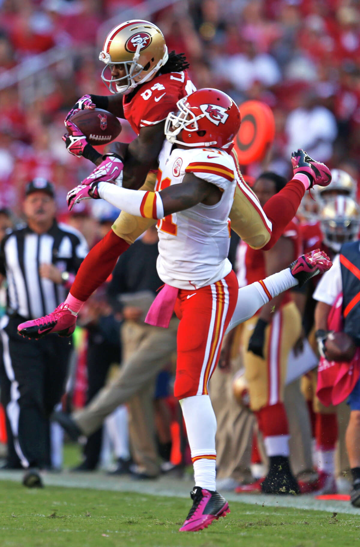The 49ers' Brandon Lloyd makes a fourth-quarter reception in front of the Chiefs' Sean Smith.