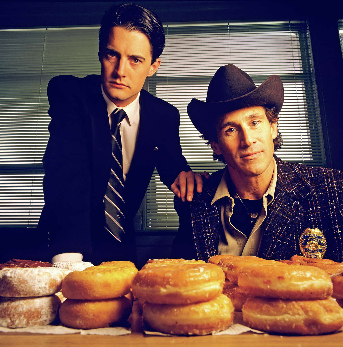 The original: Homecoming queen Laura Palmer is found dead, washed up on a riverbank wrapped in plastic sheeting. FBI Special Agent Dale Cooper (Kyle MacLaughlin, left) is called in to work with local Sheriff Harry S.Truman (Michael Ontkean) in the investigation of the gruesome murder in the small Northwestern town of Twin Peaks. 