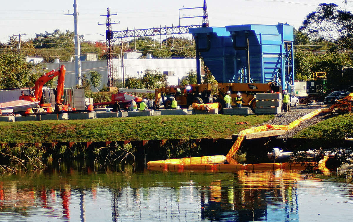 Equipment is in place in the Mill River at the former Exide Battery site in preparation for dredging to begin.