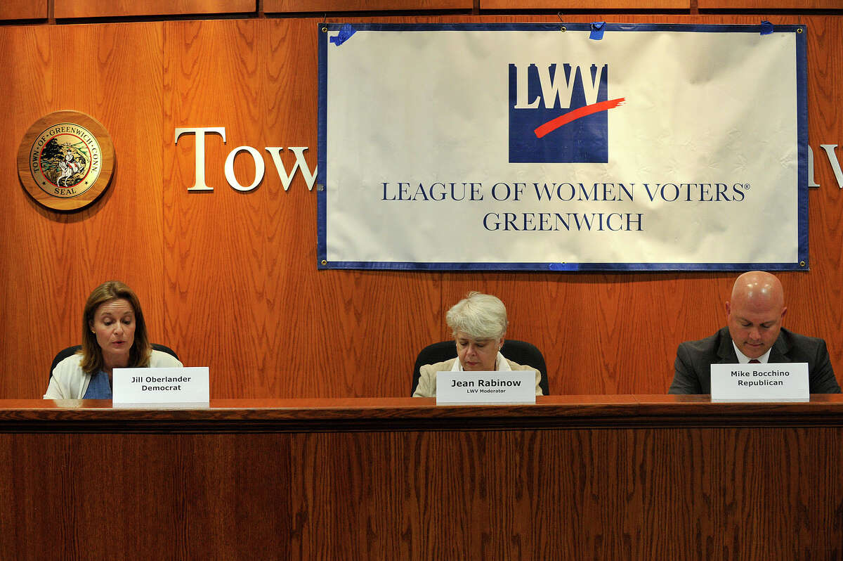 Candidates for State Representative in the 150th District Democrat Jill Oberlander, left, spars with Republican Mike Bocchino during the Greewich League of Women Voters' political debate at the Town Hall in Greenwich, Conn., on Monday, Oct. 6, 2014. The two are vying for the seat vacated by State Rep. Stephen Walco. Jean Rabinow, a Bridgeport League of Women Voters member, was the moderator.