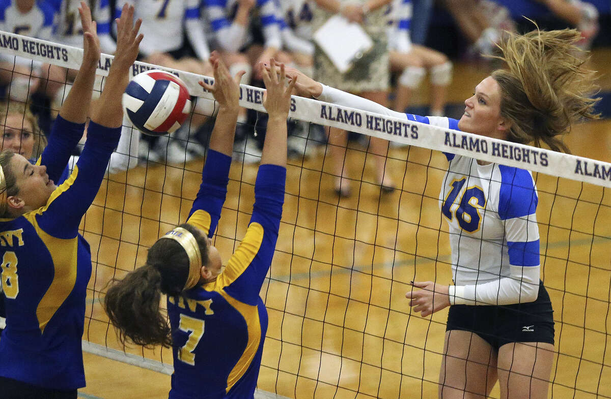 Alamo Heights middle blocker Callie Cook jams the ball over the net as the Mules host Kerrville Tivy Sept. 30 at the Alamo Heights gym.