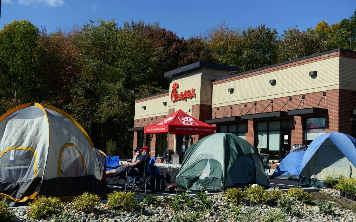 Customers camp out in front of the Chick-fil-A in Brookfield, Conn., to be among the first 100 diners and be awarded a free meal once a week for a year, Wednesday, Oct. 8, 2014.