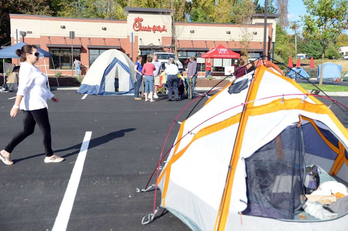 Customers camp out in front of the Chick-fil-A in Brookfield, Conn., to be among the first 100 diners and be awarded a free meal once a week for a year, Wednesday, Oct. 8, 2014.
