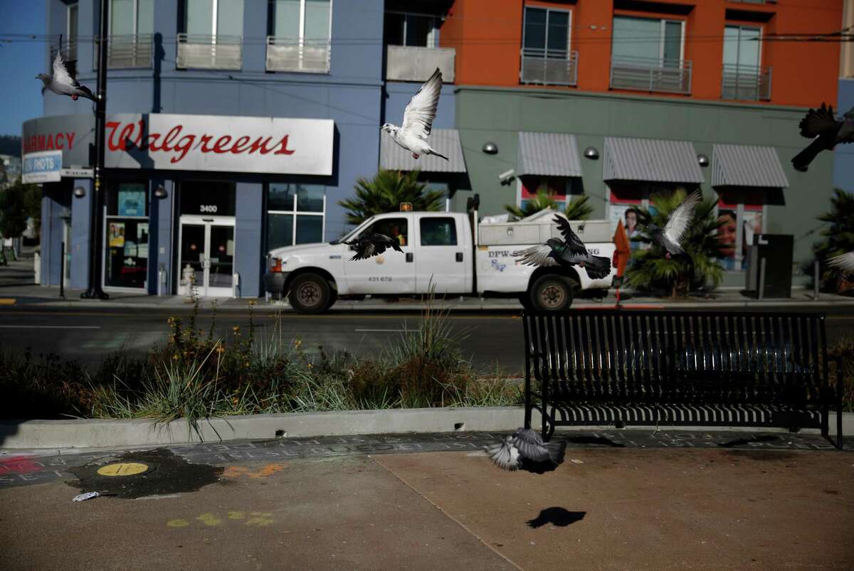 A whole filled with asphalt is seen next to an empty space which used to have a bench at a plaza at Mission Street and Cesar Chavez Street on Oct. 8 in San Francisco.