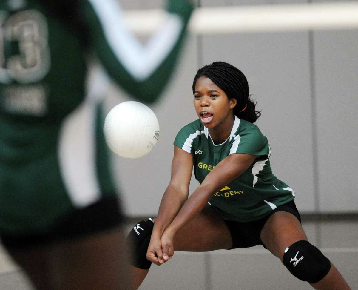 Greenwich Academy's Jadesola Ariyibi returns a shot during the girls high school volleyball match between Convent of the Sacred Heart and Greenwich Academy at Brunswick School in Greenwich, Conn., Wednesday, Oct. 8, 2014. Convent of the Sacred Heart defeated Greenwich Academy, 3-0.