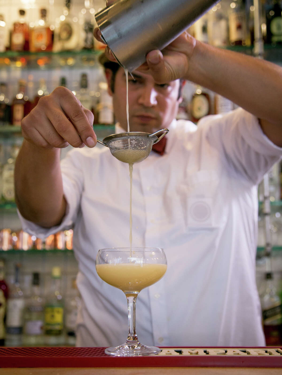 Bartender Will Herrera makes the Royal Absinthe Punch at Cafe Terminus in the Financial District of San Francisco.