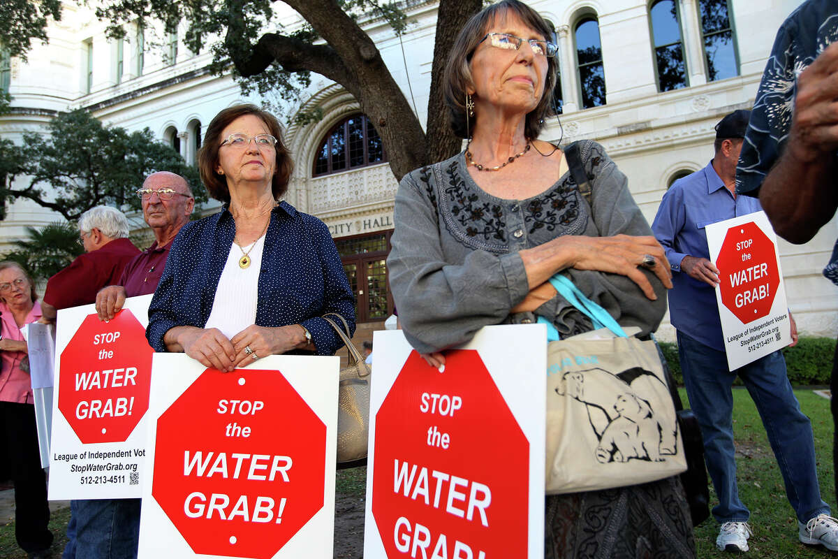 Rose Fritsche, left, of Lee County, and Charlotte Gilman, of Bastrop County, gather in front of City Hall before heading to speak against the proposed San Antonio Water Systems 142-mile water pipeline during a San Antonio City Council hearing, Wednesday, Oct. 8, 2014. The $3.4 billion pipeline would bring water from Burleson County, east of Austin, to San Antonio. It is expected to increase SAWS customers rate by as much as 17 percent.