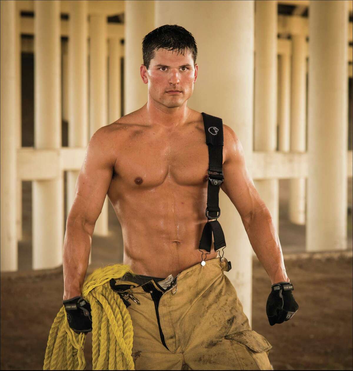 Mr. July Phillip Baird is ready to rescue. He's one of the firefighters featured in the 2015 calendar that benefits the Burned Children's Fund.