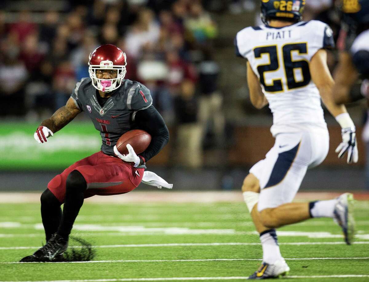 Washington State receiver Vince Mayle, looking for yardage against Cal’s Griffin Piatt, ranks No. 3 nationally with 51 catches and is one of four Cougars with six or more touchdown catches.