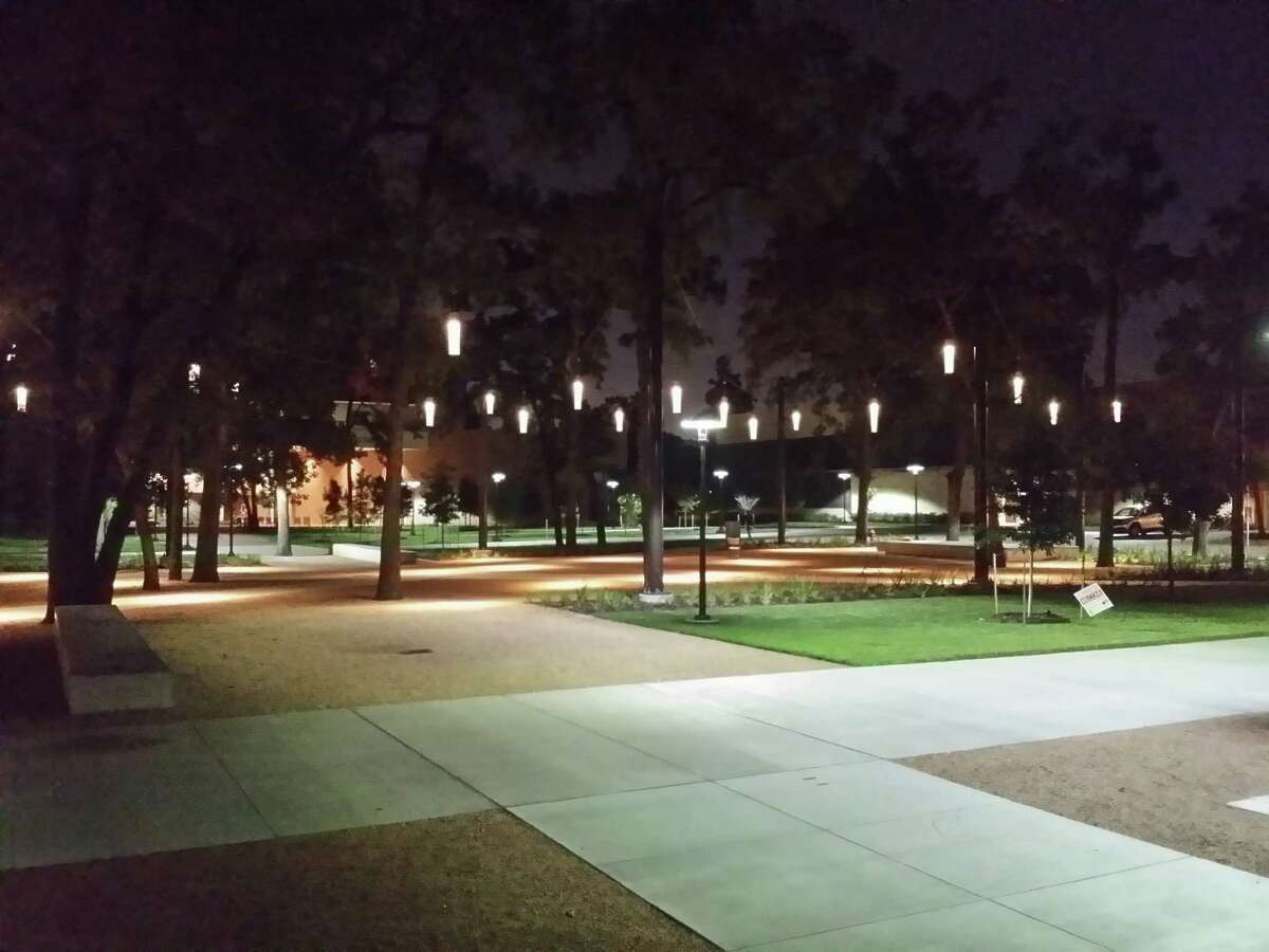 The lantern-lit Wilhelmina Grove, designed by SWA Group, serves as a gateway to the university's Lyndall Finley Wortham Theatre.