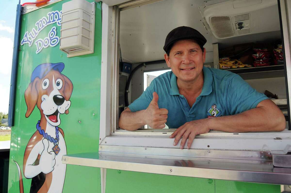 Mario B. Morales got a $5,000 loan from a microlender to help buy a better generator for his Yummy Dog food truck. ﻿