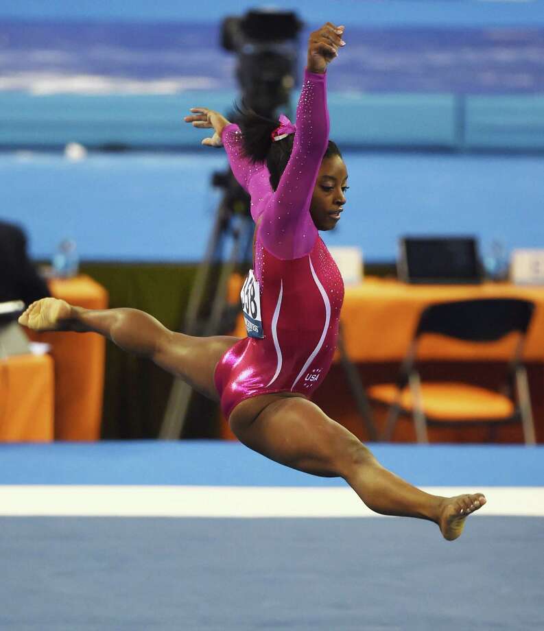 Simone Biles claims gold at 2014 world championships - Houston Chronicle