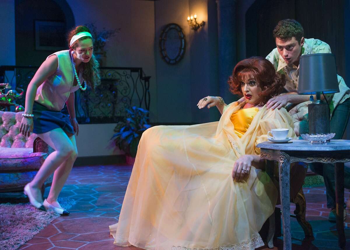 Angela (J. Conrad Frank, seated) is confronted with the suspicions of children (Ali Haas, left, and Devin O'Brien) over a death in the family in Charles Busch's "Die! Mommie, Die!" at New Conservatory Theatre Center