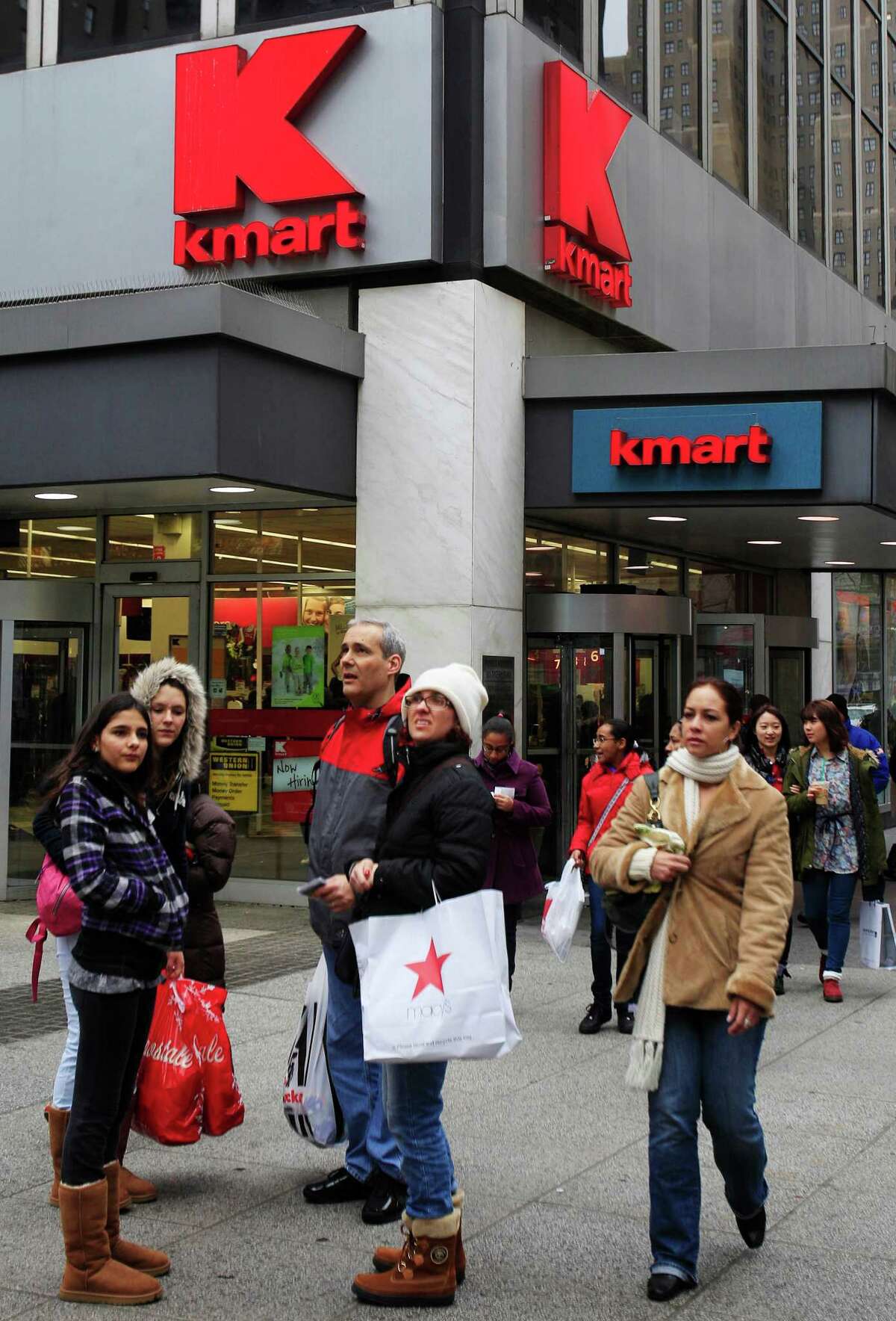 FILE - In this Tuesday, Dec. 27, 2011 file photo, pedestrians pass a Kmart store location in New York. On Friday, Oct. 10, 2014, Sears Holdings Corp. announced that it detected a data breach at its Kmart stores that started in August 2014, affecting certain customers' credit and debit card accounts. The data theft at Kmart is the latest in a string of data thefts that have hit several big retailers, including Target, Supervalu and Home Depot. (AP Photo/Frank Franklin II)