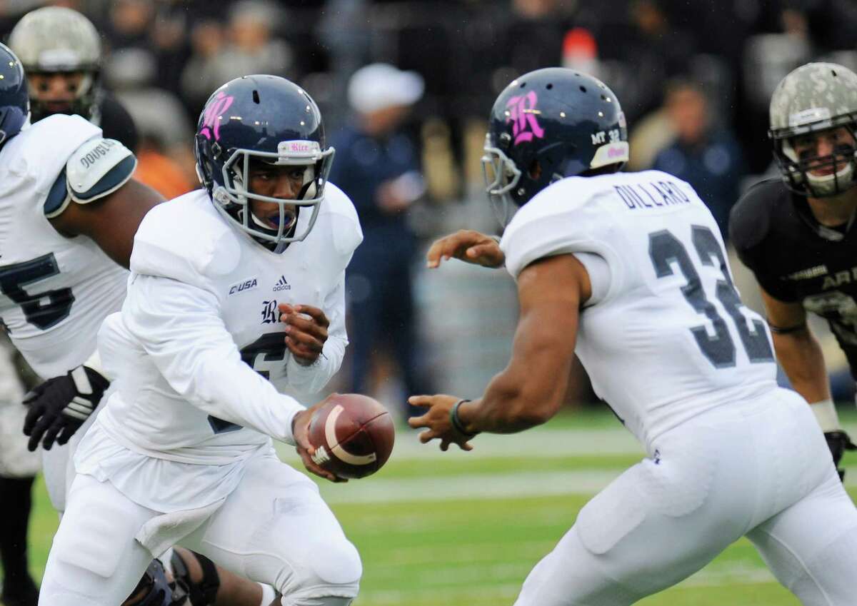 Rice quarterback Driphus Jackson (6) hands the ball to running back Darik Dillard (32) during the first half of an NCAA college football game against Rice, Saturday, Oct. 11, 2014, in West Point, N.Y. (AP Photo/Hans Pennink)