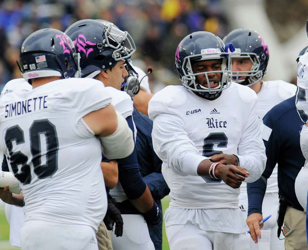 Rice quarterback Driphus Jackson (6) stands with teammates during a time out during the first half of an NCAA college football game against Army, Saturday, Oct. 11, 2014, in West Point, N.Y. (AP Photo/Hans Pennink)