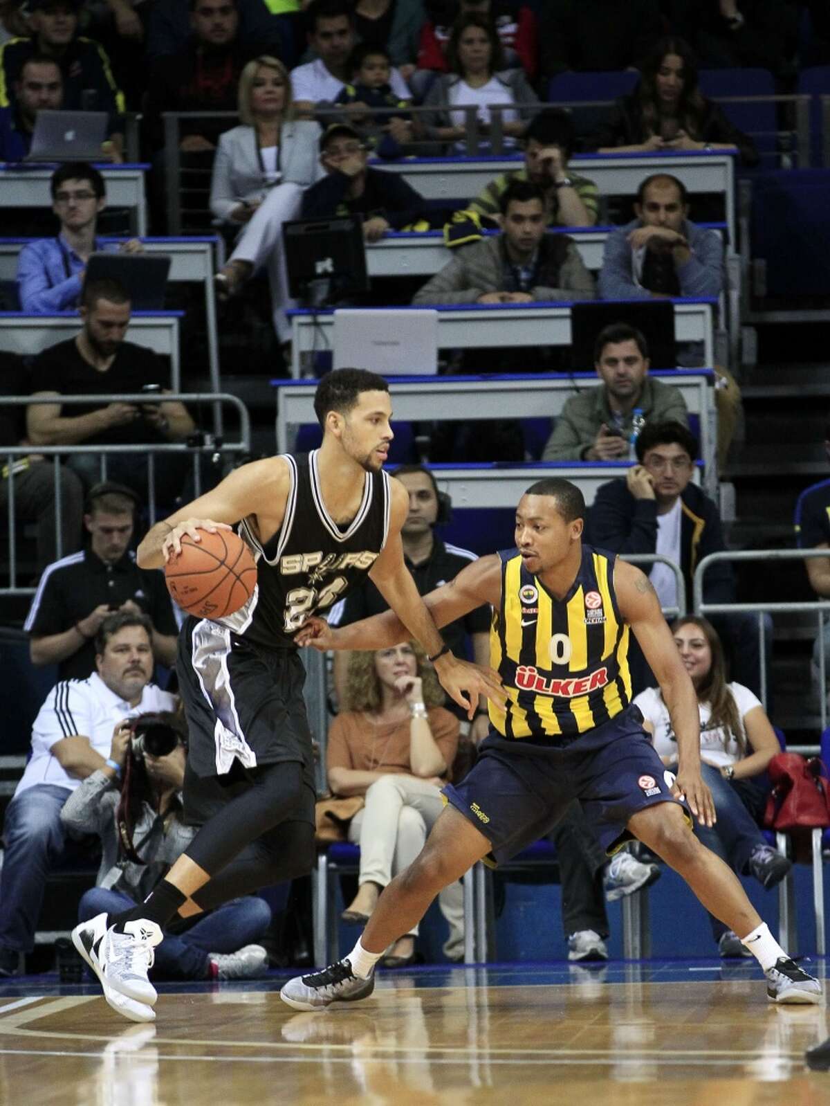 ISTANBUL, TURKEY - OCTOBER 11: Bryce Cotton (26) of San Antonio Spurs in action against Andrew Goudelock (0) of Fenerbahce Ulker during the NBA Global Games match between San Antonio Spurs, reigning NBA winners and Fenerbahce Ulker, Turkish Basketball League's defending champions at the Ulker Sports Arena in Istanbul, Turkey on October 11, 2014. (Photo by Ahmet Dumanli/Anadolu Agency/Getty Images)